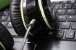 © devenorr - Black Big Wired Gaming Headset Lying On The Keyboard Of A Laptop