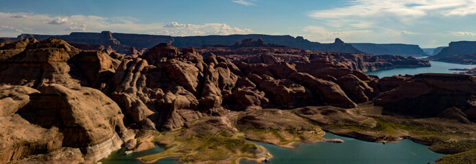 Aerial view of Lake Powell near Navjo Mountain, San Juan River in Glen Canyon with colorful buttes, skies and water