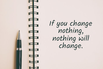Inspirational and motivation life quote on note pad - If you change nothing, nothing will change. Retro style.