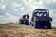 © FS-Stock - Friends driving off-road with quad bike or ATV and UTV vehicles