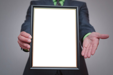 Wall Mural - Blank diploma or certificate mock up in businessman hand. Empty photo frame border with copy space.