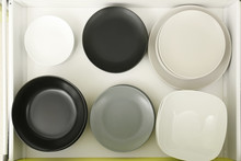 Set Of Ceramic Plates In Kitchen Drawer