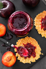 Sticker - Jar with tasty plum jam and wafers on table