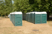 Rows Of Green Portaloos Or Platic Mobile Toilets At Festival
