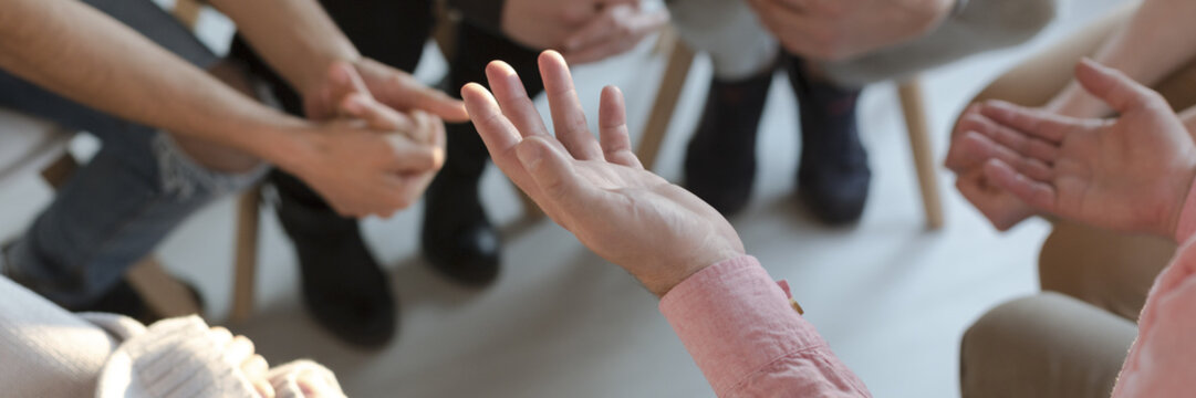 panorama of therapist's hands while gesticulating during group therapy