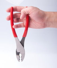 Wall Mural - Pliers. Pliers in hand on background