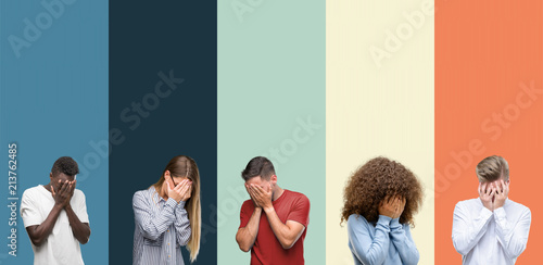 Group of people over vintage colors background with sad expression covering face with hands while crying Poster Mural XXL