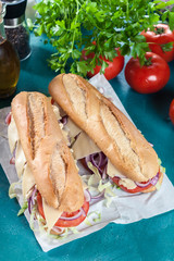 Poster - Submarine sandwiches with ham, cheese and vegetables