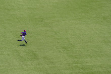 American Youth Baseball Player Running On Field