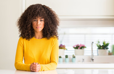 Poster - African american woman wearing yellow sweater at kitchen skeptic and nervous, frowning upset because of problem. Negative person.