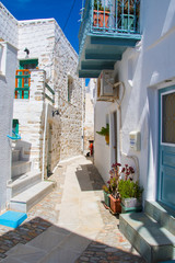 Naklejka na meble  Paved narrow alley of Ano Syros in Syros island, Cyclades, Greece. Street view