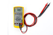 © Nischaporn - Yellow Digital multimeter with probes on white background , A multimeter  is an electronic measuring instrument.