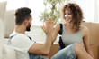 © ASDF - happy couple barking each other five with a new house