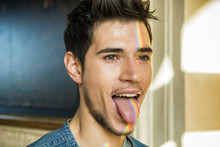 Young Man Showing Tongue, Rainbow Reflection