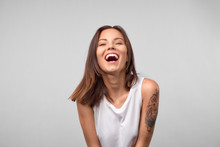Beautiful Euphoric Teenage Girl Enjoying Weekend At Home, Looking And Smiling At Camera, Cheerful Happy Young Girl Smiling Laughing Over White Background. People And Lifestyle Concept
