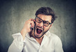 © pathdoc - Angry man speaking on phone and yelling