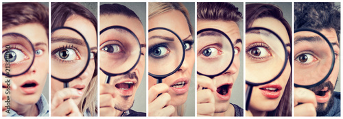 Group of curious women and men looking through a magnifying glass Poster Mural XXL