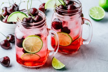 Wall Mural - Cherry Limeade or Lemonade in glass mason jar. Ice cold summer drink.