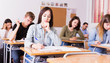 © JackF - schoolgirl is sitting test and answer about task