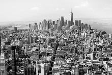 Cityscape Skyline Of Various Buildings, Skyscrapers And Architecture Looking Down On Midtown Manhattan In New York City Towards Downtowns Financial District In Black And White