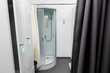 © sonyachny - shower room with cabin and lockers in physiotherapy rehab clinic. modern rehabilitation equipment. fitness wellness hygiene concept. space for text