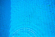 Ripples movement in a deep swimming pool with wavy shadows and light refraction