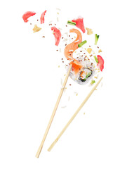 Wall Mural - Unfolded sushi roll is sandwiched between of wooden chopsticks on white background