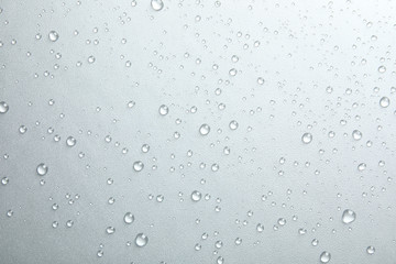 many clean water drops on grey background
