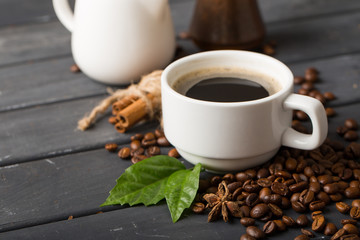 Wall Mural - black coffee beans on black background