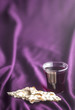 Christian Communion on a Purple Fabic Background