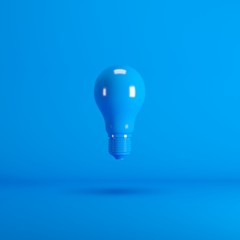 Wall Mural - Levitating Blue Lightbulb floating on blue background color. minimal idea concept.