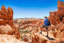 Man Hiking In The Mountains. Beautiful Red Mountain Landscape.  Bryce Canyon National Park, Utah, USA