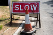 UK slow sign and road cone