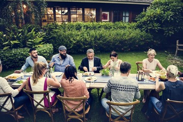 Group of diverse friends are having a dinner together