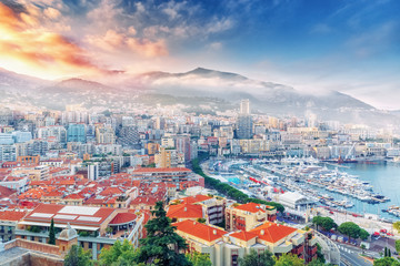 Wall Mural - Principality of Monaco. Beautiful panoramic view on Monaco, golden hour scenery. View on apartment building, casino, great port with luxury yachts. Monaco is popular travel destination, wealth symbol.