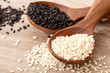 organic Black and white sesame seeds in a wooden spoon , top view or overhead shot