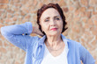 © olezzo - Portrait of a mature attractive  50-60 years stylish woman retired and outdoors on a summer sunny day, head shot