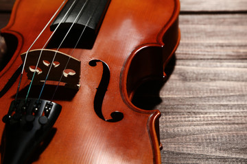 Wall Mural - Violin on brown wooden table