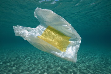 Wall Mural - Underwater a plastic bag below water surface in the Mediterranean sea , Almeria, Andalusia, Spain