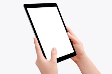 Wall Mural - Female hands holding black tablet in vertical position isolated on white background. Empty screen for mockup design