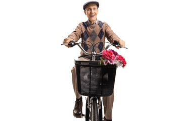 Wall Mural - Elderly man riding a bicycle