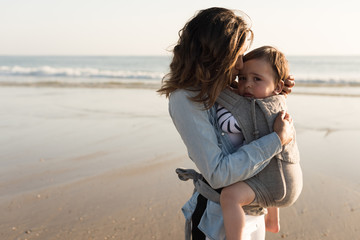 Wall Mural - mother carrying baby