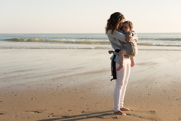 Wall Mural - mother carrying baby