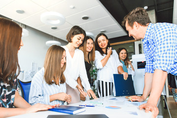 Wall Mural - business team in casual clothes confer at a table in the office