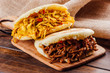 Typical South American breakfast, arepa with chicken and roasted meat
