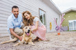© LIGHTFIELD STUDIOS - happy couple palming labrador at animals shelter and choosing for adoption