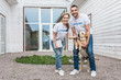 © LIGHTFIELD STUDIOS - smiling volunteers of animals shelter palming labrador and looking at camera