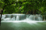 Fototapeta Krajobraz - Beautiful and Breathtaking green waterfall at the tropical rain forest, Erawan's waterfall, Located Kanchanaburi Province, Thailand