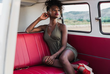 Gorgeous Black Woman Sitting On Back Seat Of Van