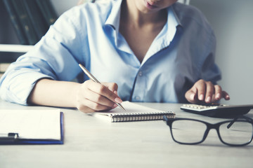 woman hand calculator with notepad